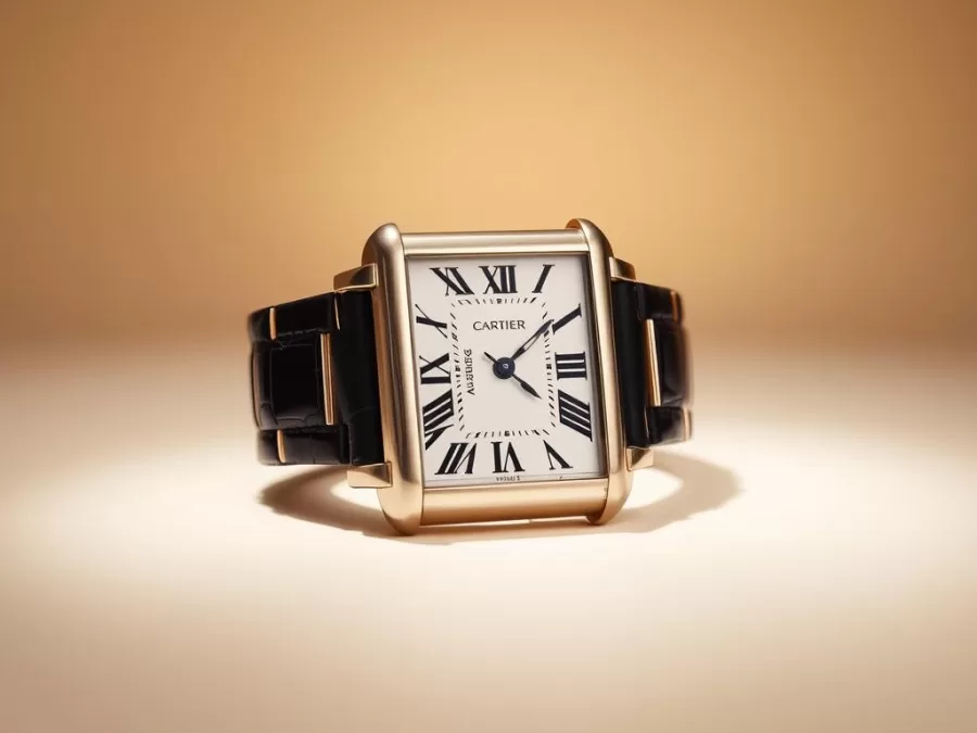 Cartier Tank watch with its iconic rectangular case and Roman numeral dial