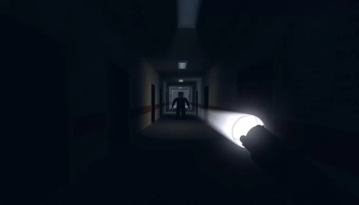 Screenshot from Silent Dark showing a dark abandoned facility with flashlight illumination