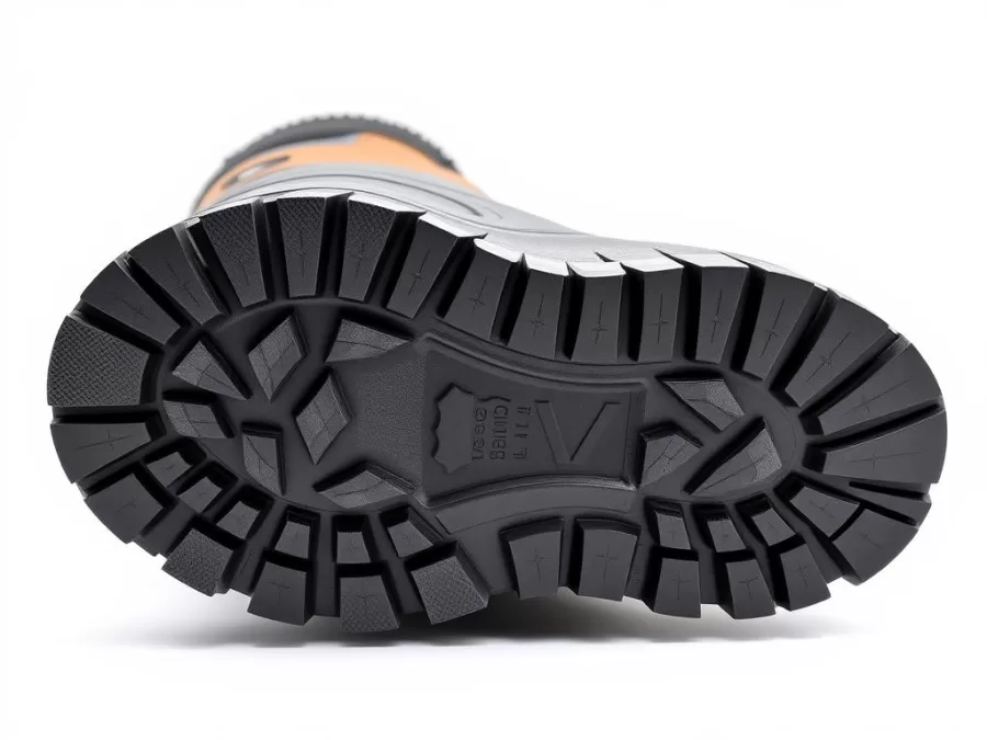 Bottom view of winter boot sole showing deep lug pattern designed for snow and ice traction
