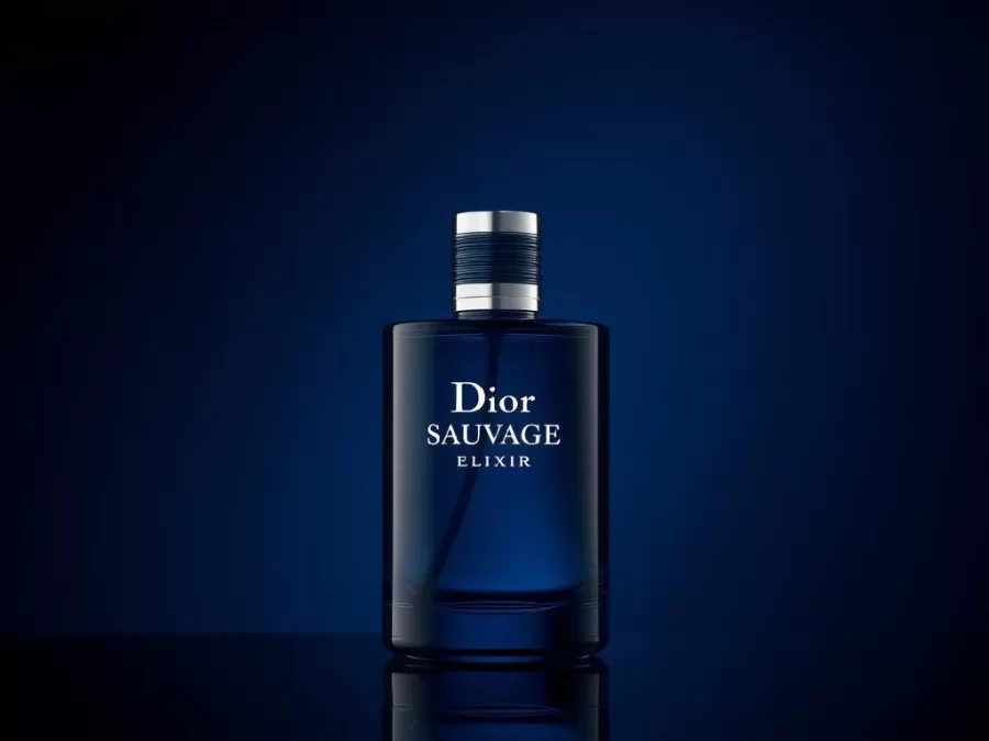 Dior Sauvage Elixir bottle with its distinctive deep blue glass and silver cap