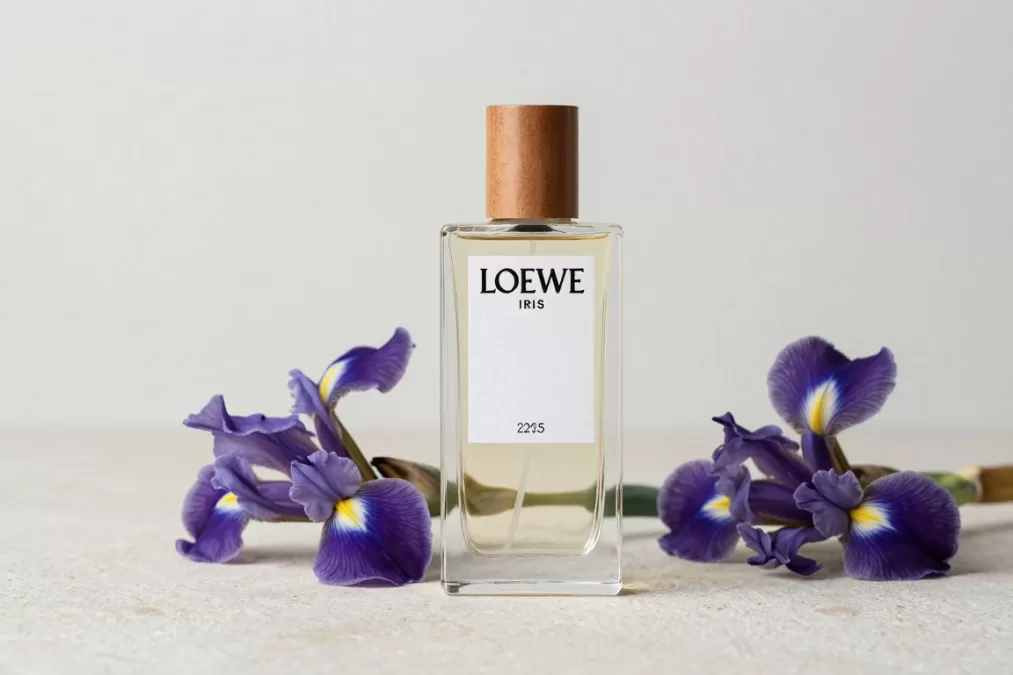 Loewe Iris Root bottle with architectural design against snowy background