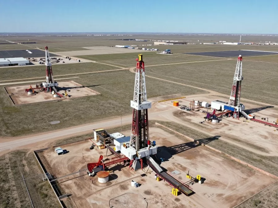 Aerial view of Permian Basin oil fields with multiple active drilling rigs in Texas, a key region for top oil producing countries in 2026