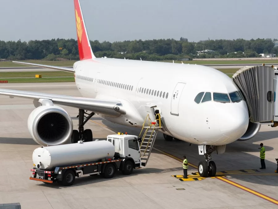 Aircraft being refueled on an airport tarmac