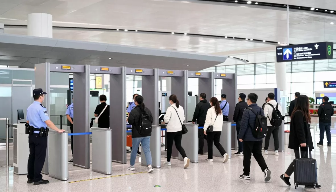 Airport security checkpoint with passengers going through screening