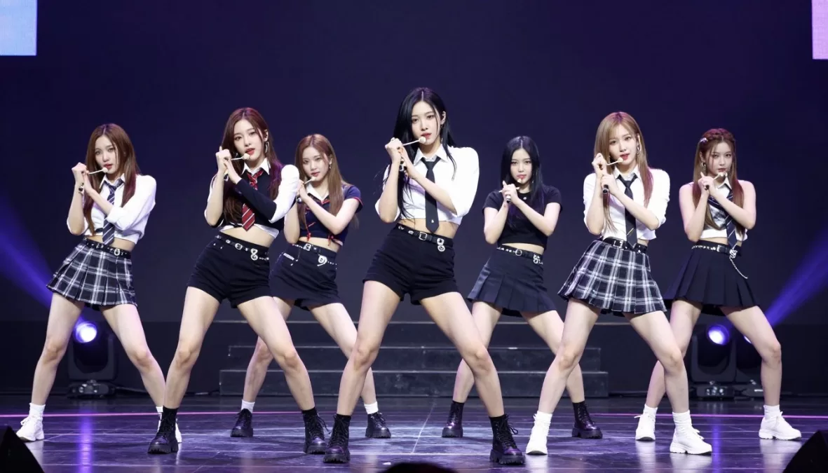 NMIXX performing on stage with their signature powerful choreography, ranked #10 in top 10 kpop groups 2026