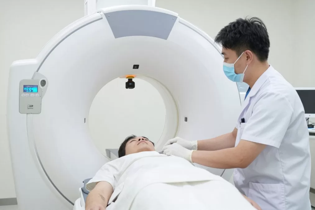 Radiation therapist operating medical equipment