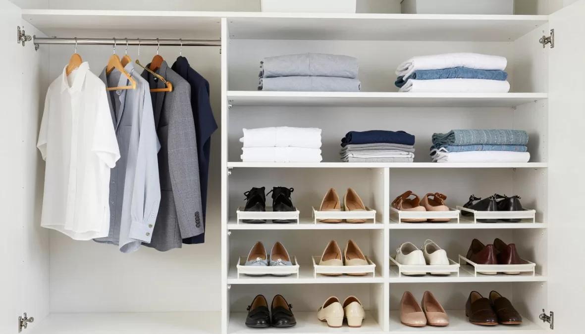 Organized wardrobe storage showing proper hanging and folding techniques