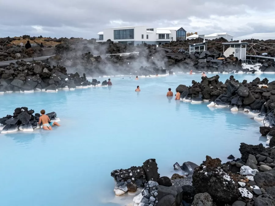 Blue Lagoon geothermal spa in Iceland with milky blue water surrounded by black lava rocks