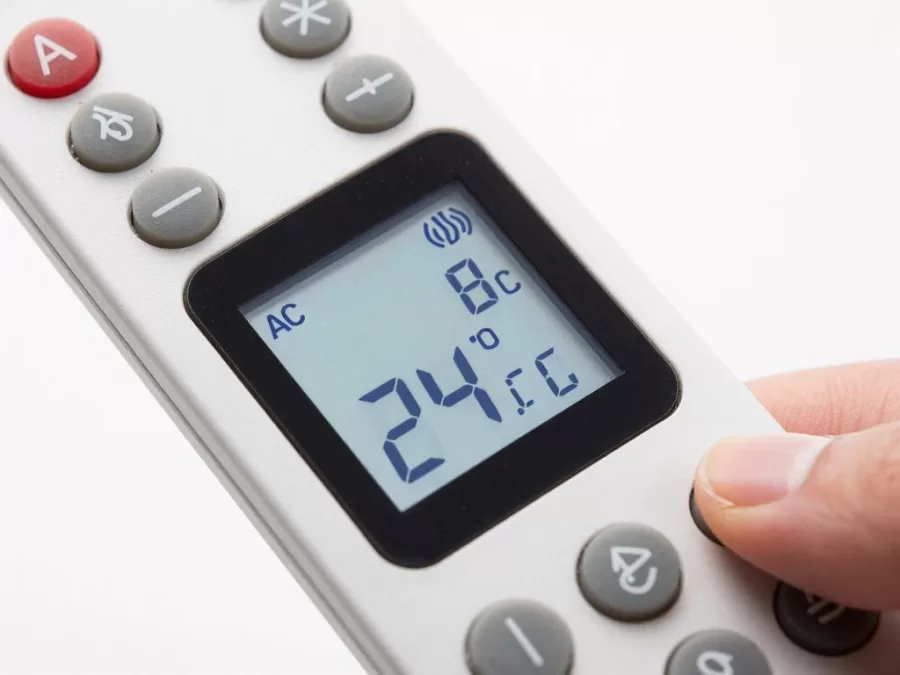 Digital thermostat showing optimal 24 degree temperature setting for energy efficiency Digital thermostat showing optimal 24 degree temperature setting for energy efficiency