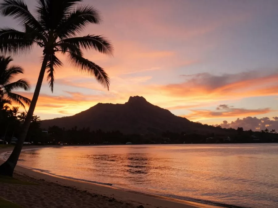 Matira Beach sunset Mount Otemanu silhouette palm trees