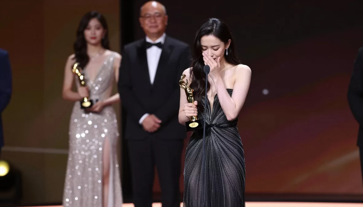 Actress accepting award showcasing industry recognition