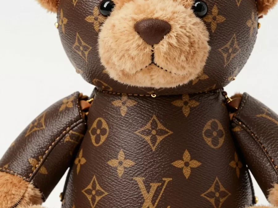 Close-up of Louis Vuitton teddy bear showing intricate monogram pattern details and stitching