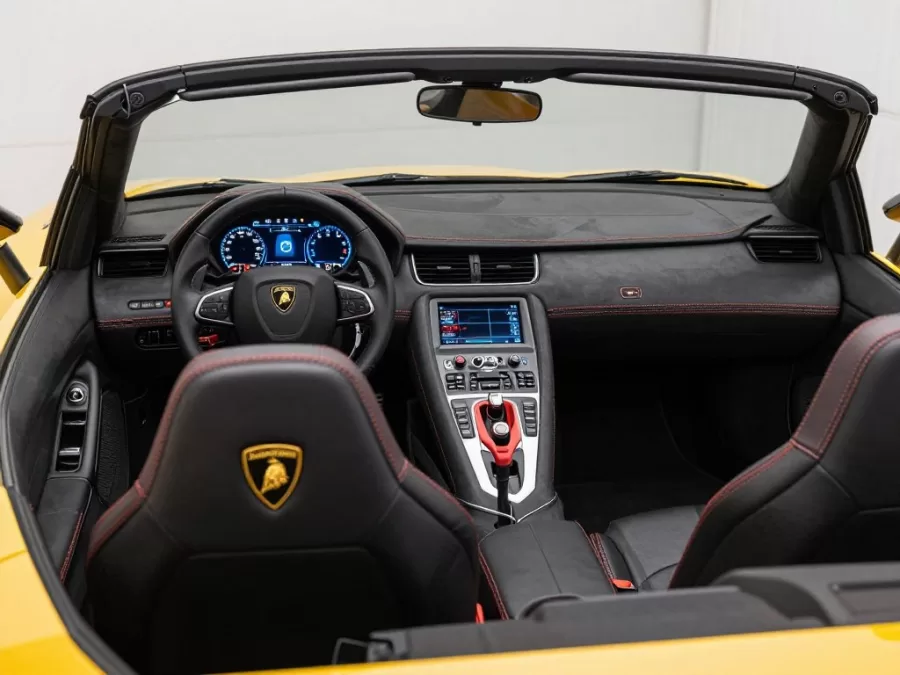 Lamborghini ride-on car interior showing leather seats and digital display dashboard