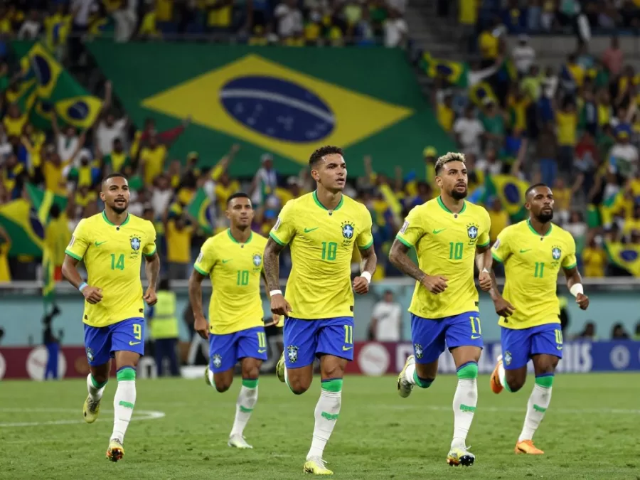 Brazil team celebrating goal in yellow jerseys Brazil team celebrating goal in yellow jerseys