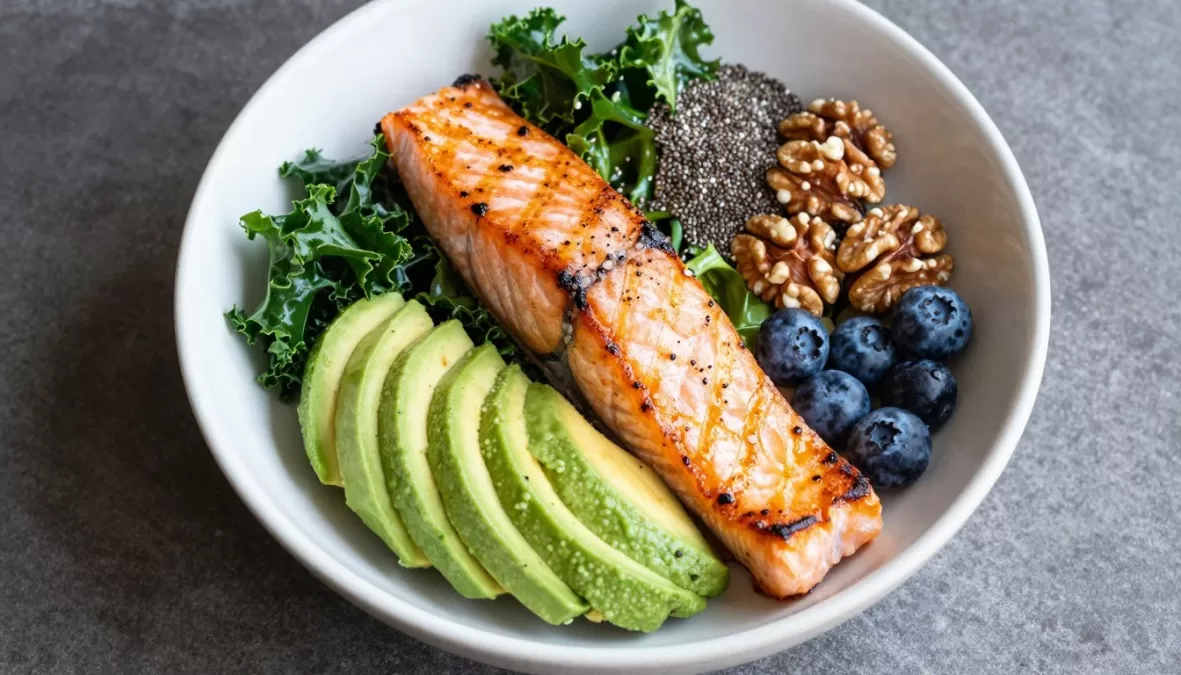 Buddha bowl featuring multiple superfoods including salmon, avocado, kale, and seeds