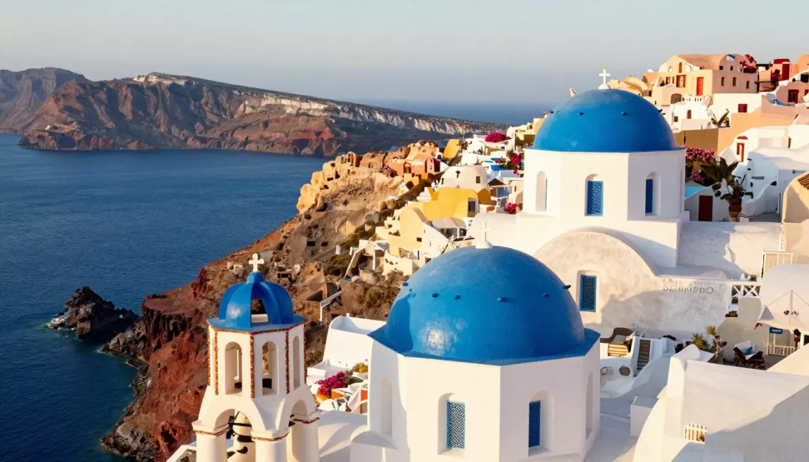 Greece Santorini white buildings and blue domes representing iconic destination