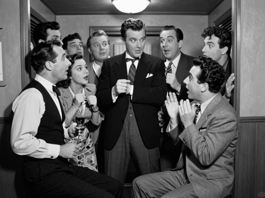 Marx Brothers in classic comedy scene with crowded stateroom