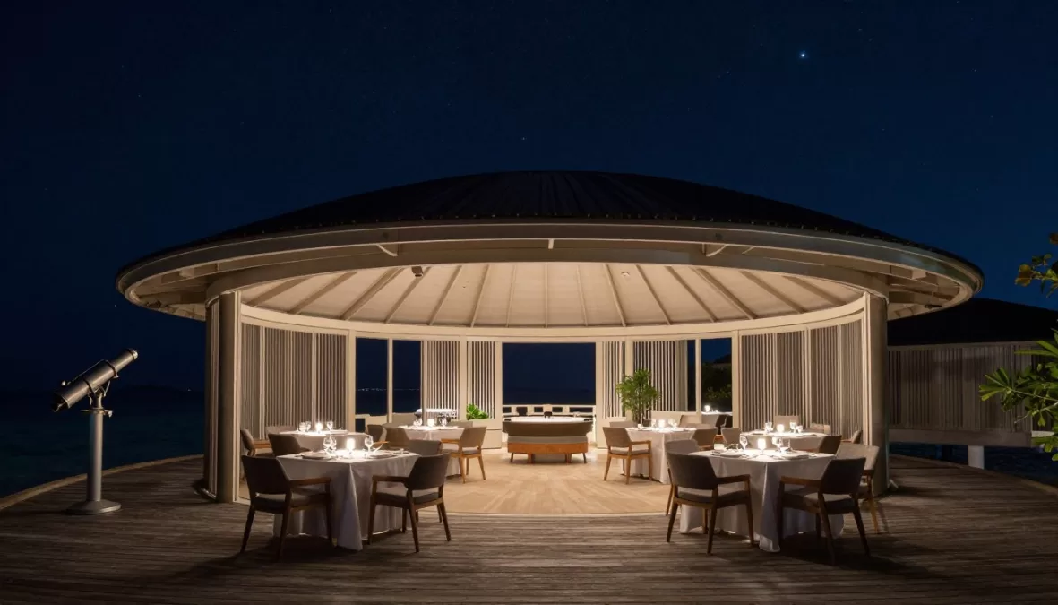 Observatory restaurant at Soneva Jani with open roof showing starry night sky