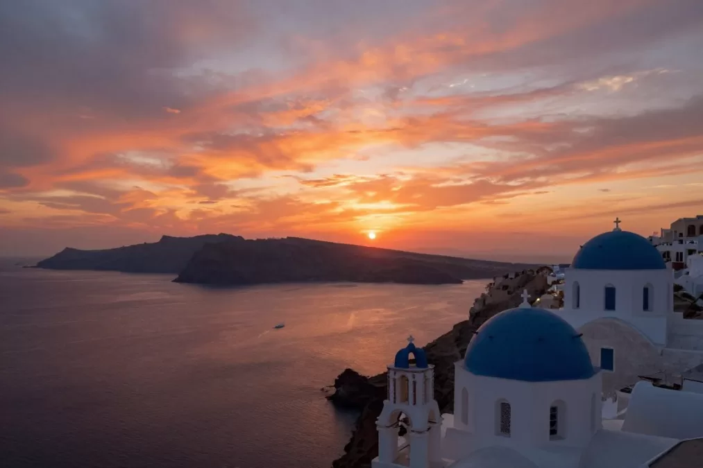 Santorini caldera sunset view with volcanic islands