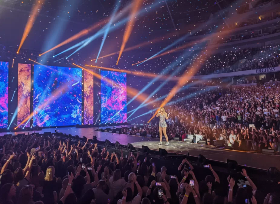 Taylor Swift performing during the Eras Tour with massive stage production