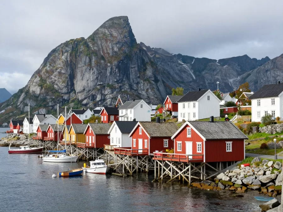Traditional Norwegian fishing village on fjord shore