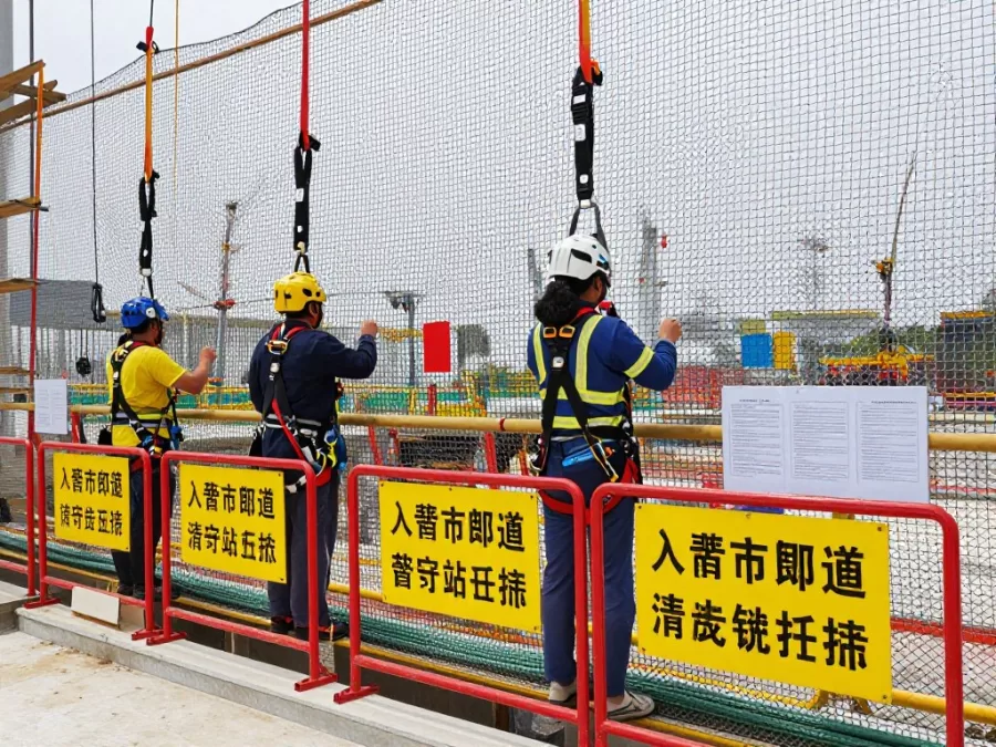 Construction site showing fall protection and safety equipment