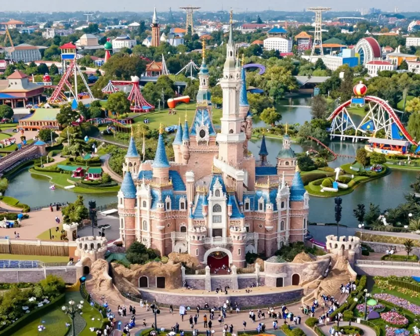 Disney entertainment company theme park with crowds enjoying attractions