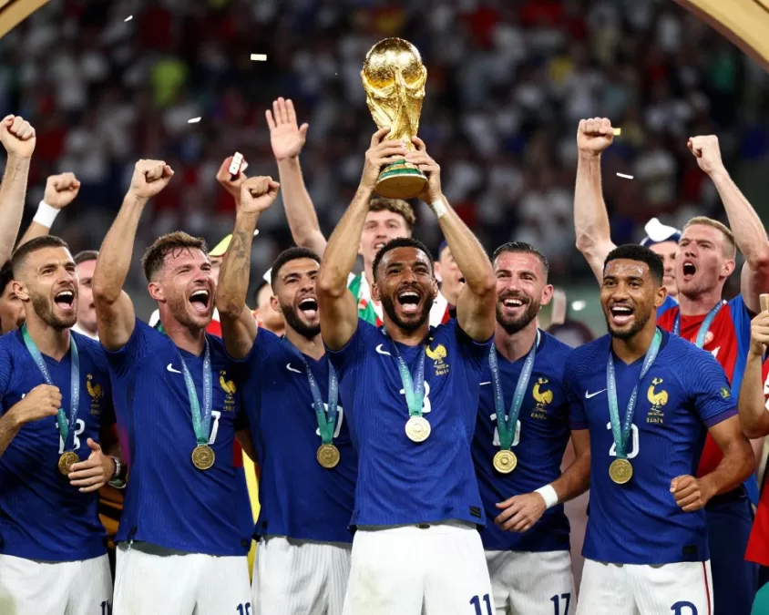 France national team celebrating as world cup champions with trophy