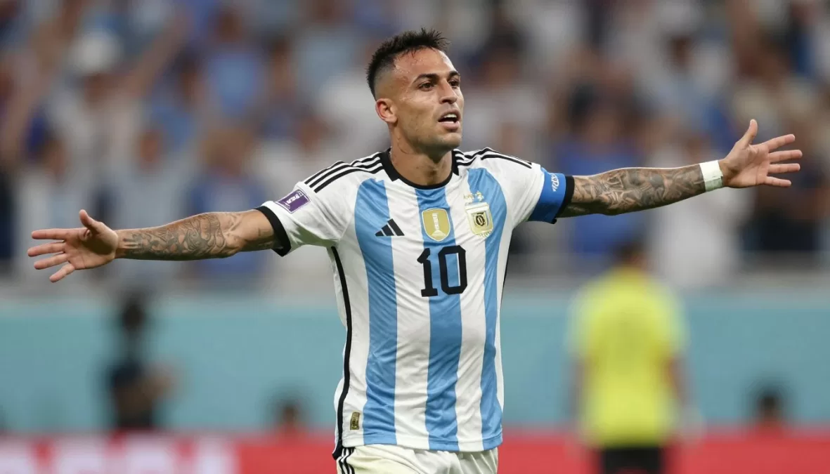 Lautaro Martinez celebrating goal in Argentina striped jersey during world cup