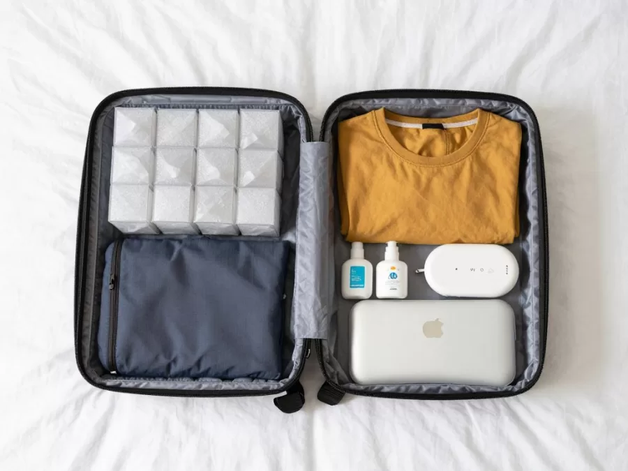Minimalist travel packing with organized single backpack and essential items