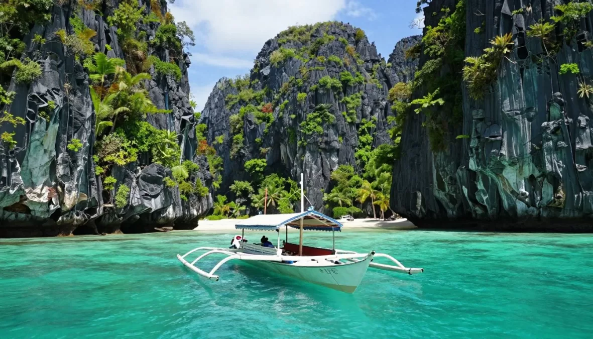 Palawan limestone karst cliffs surrounding turquoise lagoon with traditional boat