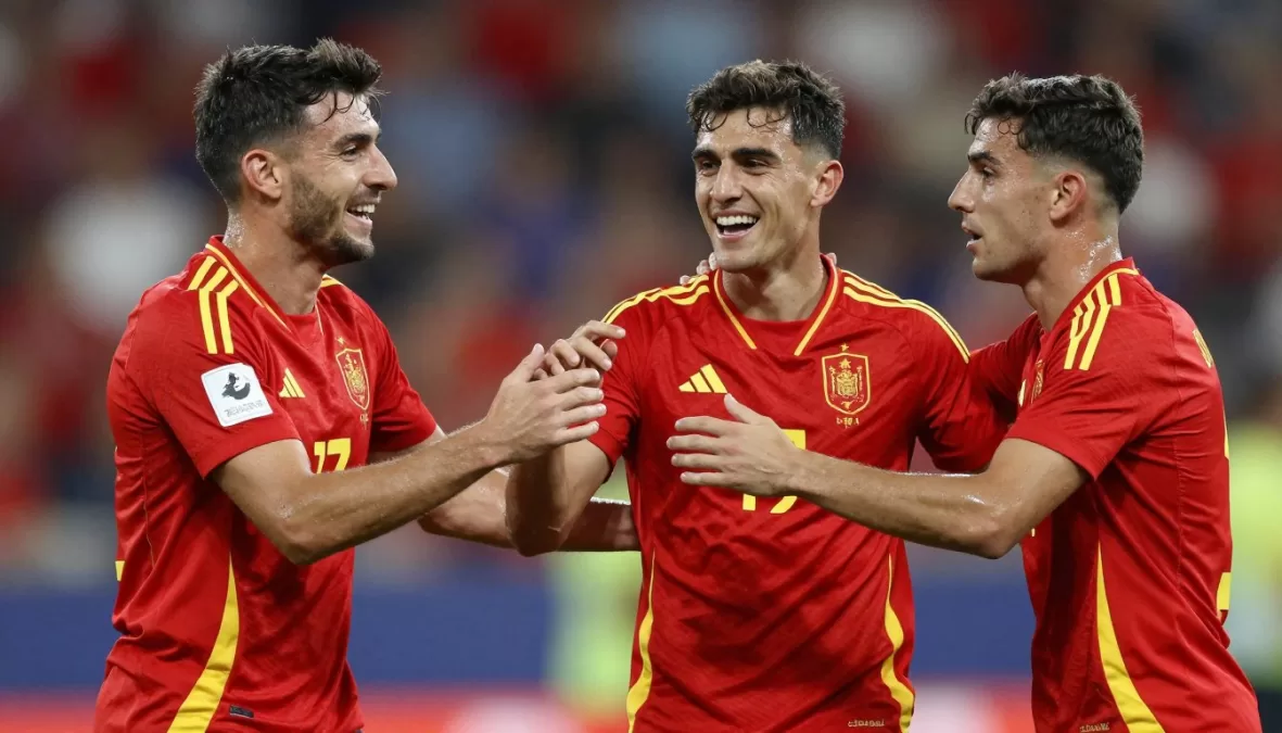 Pedri and Gavi celebrating goal together in Spain red jerseys