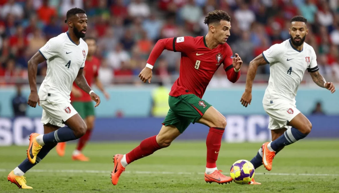 Rafael Leao sprinting with soccer ball in Portugal red jersey
