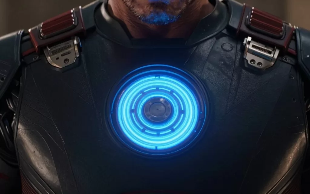 Tony Stark's arc reactor glowing in his chest