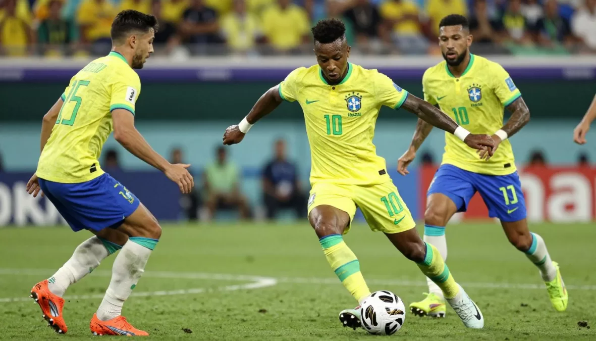 Vinicius Junior skillfully dribbling past defenders in Brazil yellow jersey
