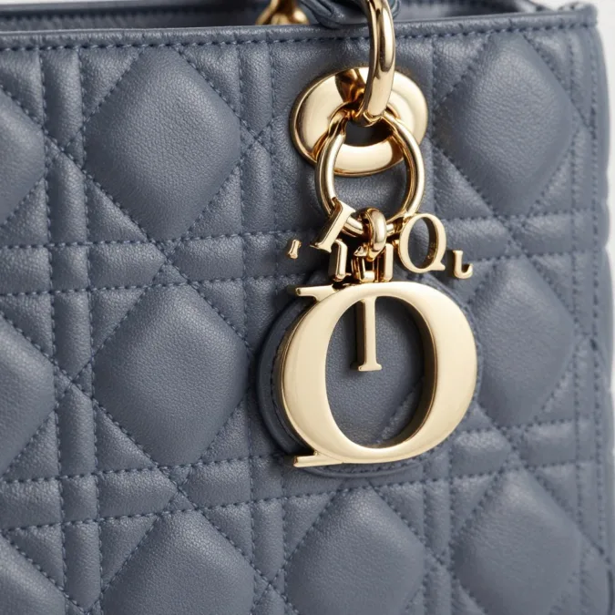Detailed view of Dior Cannage quilting and charm hardware