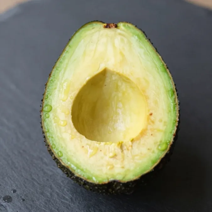 sliced avocado with healthy fats for muscle growth and hip development