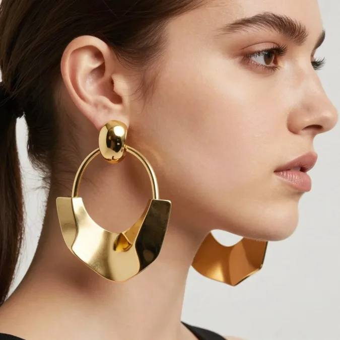 statement earrings 2026 oversized hoops geometric shapes sculptural jewelry gold silver designs