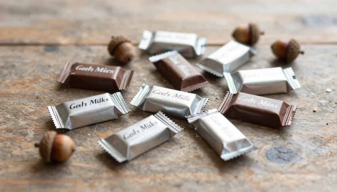 Classic miniature chocolate bars scattered across a festive tabletop Classic miniature chocolate bars scattered across a festive tabletop