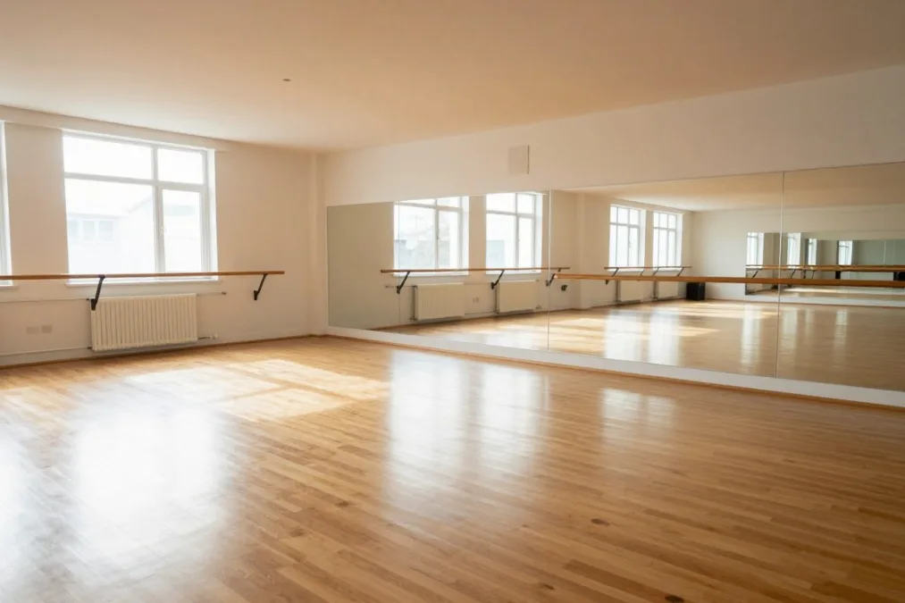 Dance rehearsal studio with polished wooden flooring and natural sunlight Dance rehearsal studio with polished wooden flooring and natural sunlight