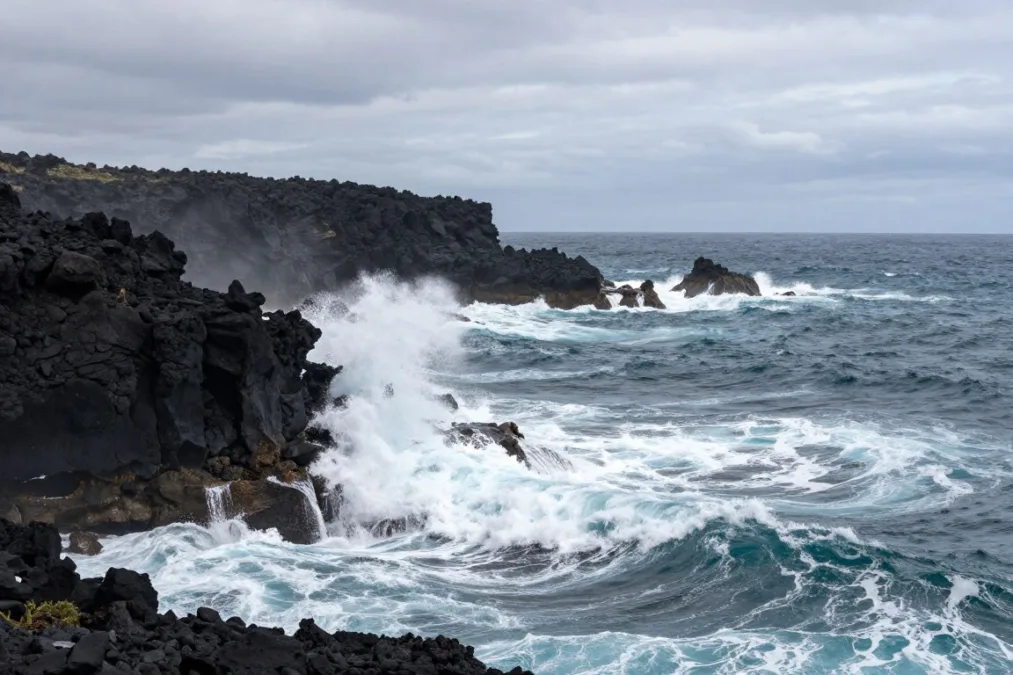 Rocky Pacific coastline with strong breaking waves