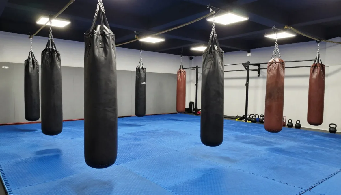 Stunt training gym with foam tumbling blocks and punching bags